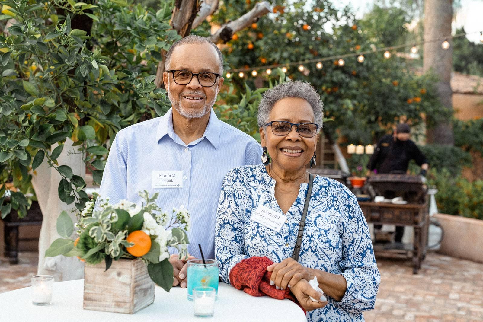 Alumni pose for a photo at an event